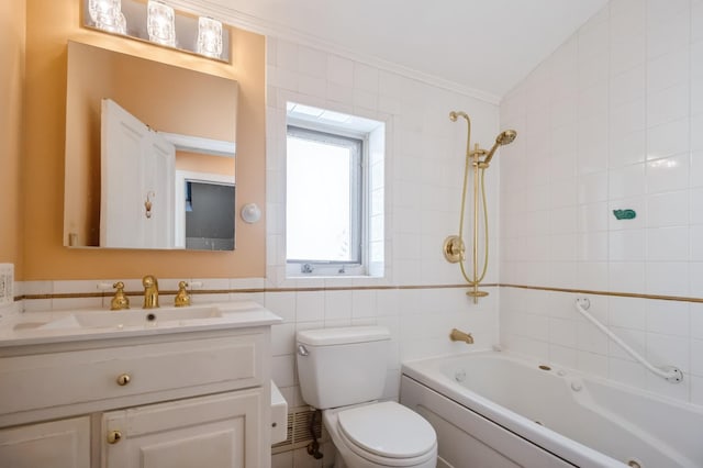 full bathroom with tiled shower / bath, lofted ceiling, tile walls, vanity, and toilet