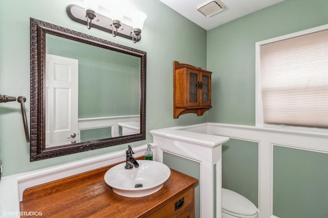 bathroom with vanity and toilet