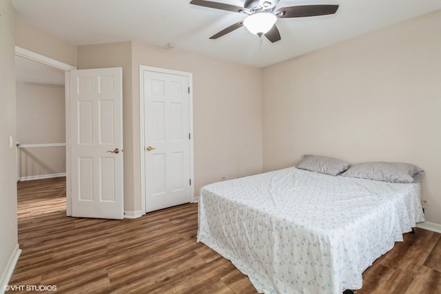 bedroom featuring dark wood-type flooring and ceiling fan