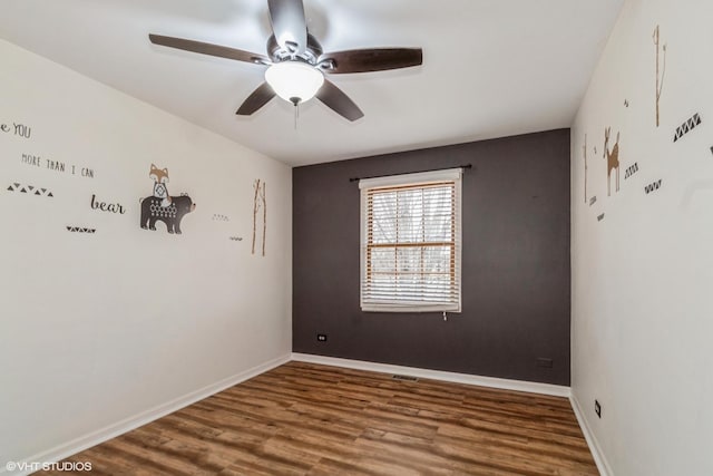 unfurnished room with wood-type flooring and ceiling fan