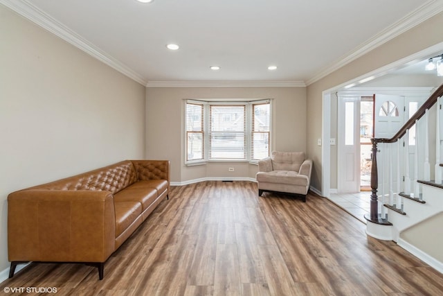 unfurnished room featuring ornamental molding and hardwood / wood-style floors