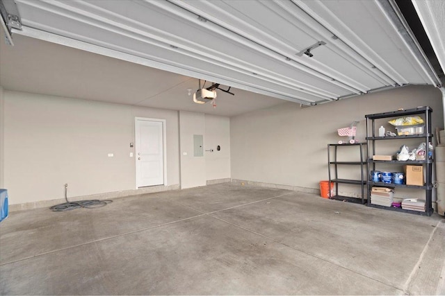 garage featuring a garage door opener and electric panel