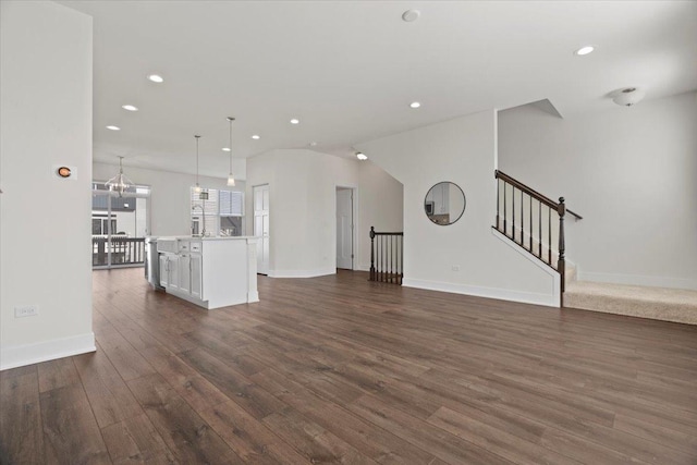 unfurnished living room with dark wood-type flooring