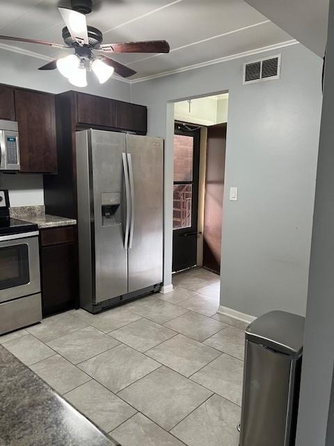 kitchen with ornamental molding, appliances with stainless steel finishes, ceiling fan, and dark brown cabinetry