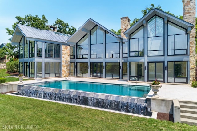 28 Brinker Rd, Barrington Hills, IL 60010 - rear view of property with a chimney, a lawn, an infinity pool, and a patio