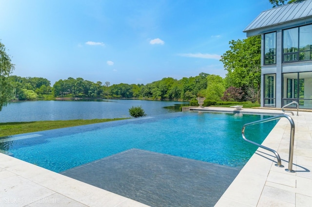 28 Brinker Rd, Barrington Hills, IL 60010 - view of swimming pool featuring an infinity pool, a water view, and a patio