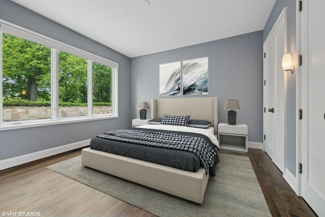 28 Brinker Rd, Barrington Hills, IL 60010 - bedroom with wood finished floors and baseboards