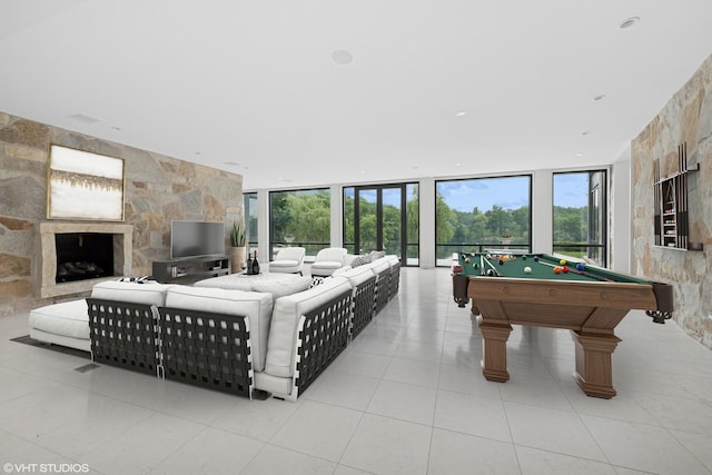28 Brinker Rd, Barrington Hills, IL 60010 - rec room featuring tile patterned floors, floor to ceiling windows, pool table, and a stone fireplace