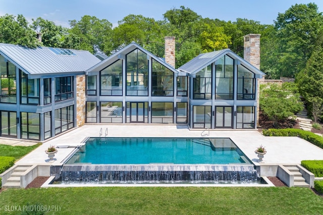 28 Brinker Rd, Barrington Hills, IL 60010 - back of house featuring a patio area, a lawn, and a chimney