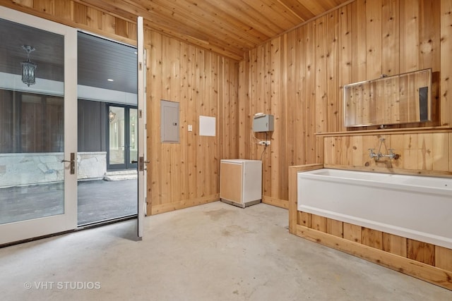 28 Brinker Rd, Barrington Hills, IL 60010 - bathroom featuring a bath, unfinished concrete floors, wood walls, electric panel, and wooden ceiling