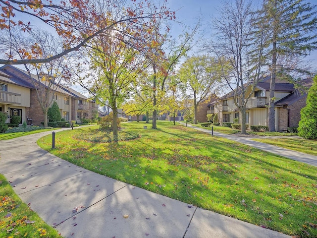 view of home's community featuring a yard