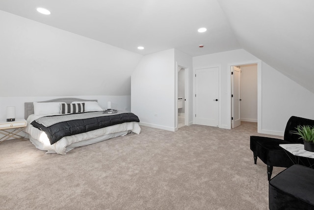 carpeted bedroom featuring lofted ceiling