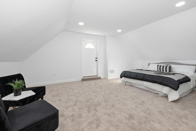 bedroom featuring vaulted ceiling and carpet floors