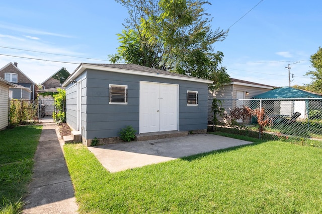 view of outbuilding featuring a yard