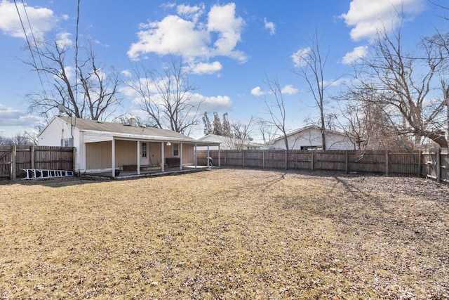 view of yard with a fenced backyard and a patio