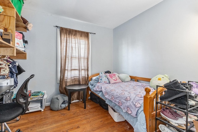 bedroom with wood finished floors