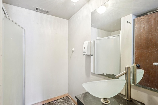 bathroom featuring vanity and walk in shower