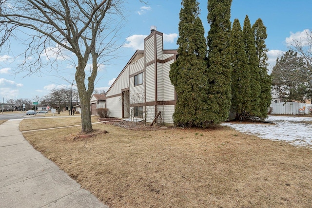 view of home's exterior featuring a yard