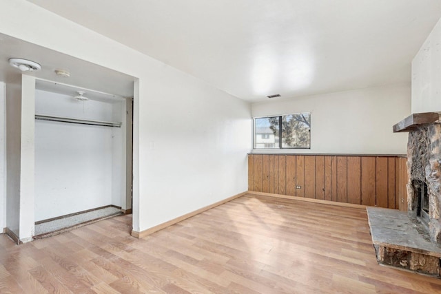 unfurnished living room with light wood-type flooring