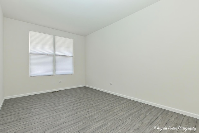 empty room featuring light hardwood / wood-style floors