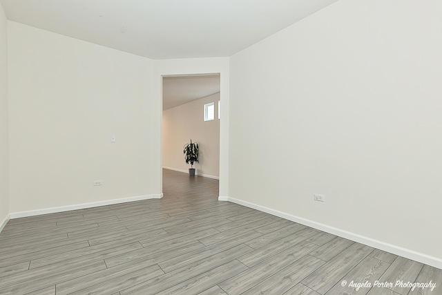 spare room with light hardwood / wood-style floors