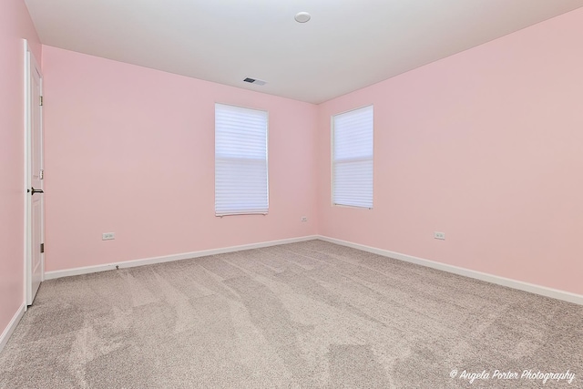 spare room with carpet