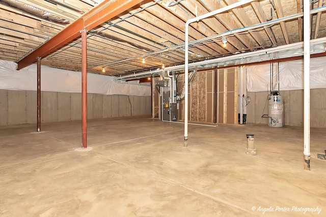 basement with gas water heater and heating unit