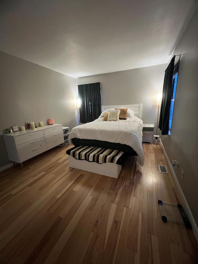 bedroom with light hardwood / wood-style flooring