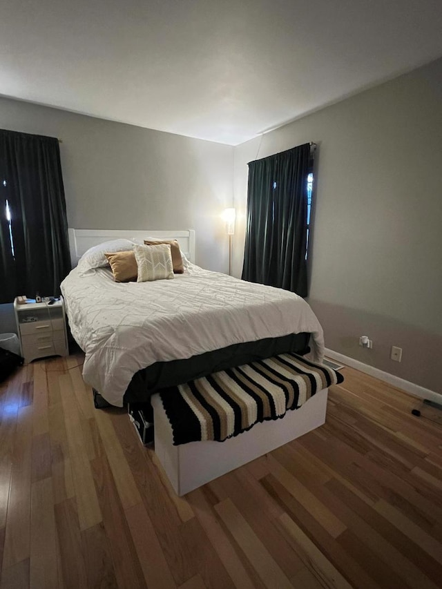 bedroom featuring wood-type flooring