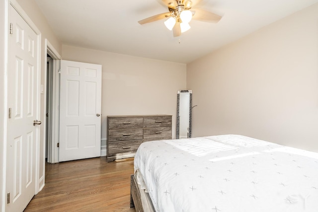 bedroom featuring ceiling fan and hardwood / wood-style floors