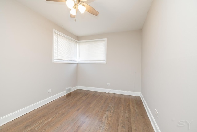 empty room with ceiling fan and wood-type flooring