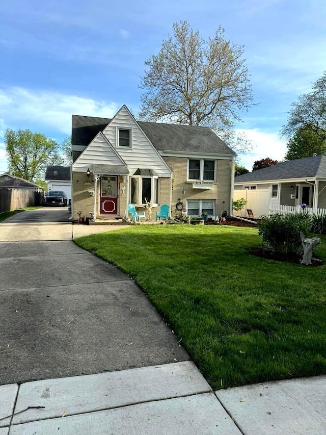 view of front facade featuring a garage and a front lawn