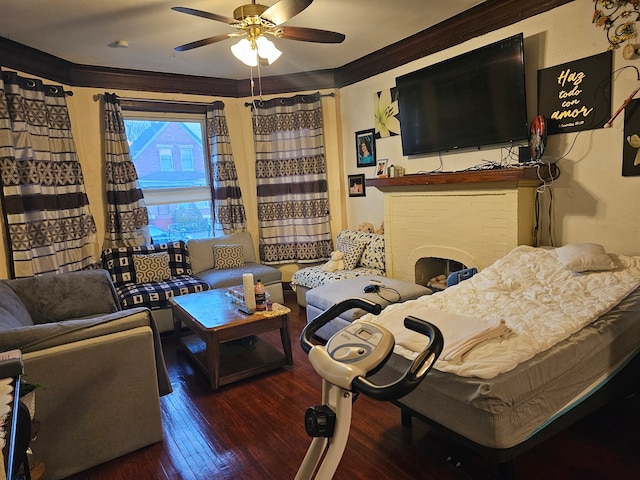 living room with ceiling fan, crown molding, and dark hardwood / wood-style flooring