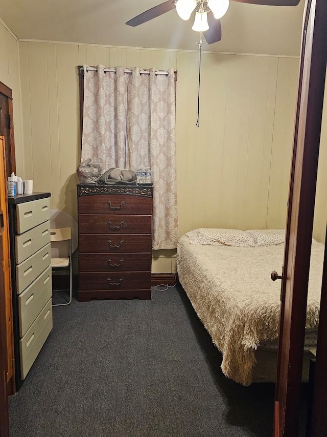 bedroom featuring dark colored carpet and ceiling fan