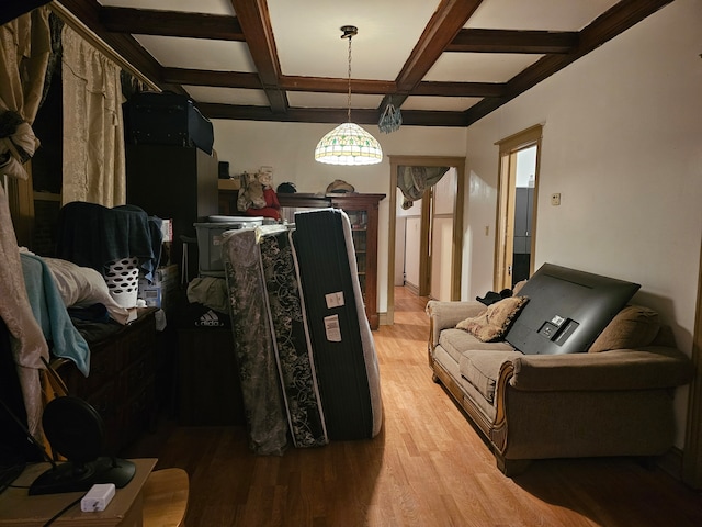 living room with coffered ceiling, beam ceiling, and light wood-type flooring