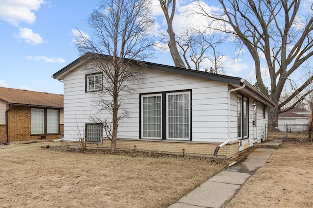 view of home's exterior featuring a lawn