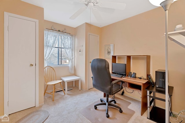 office area with ceiling fan and light colored carpet