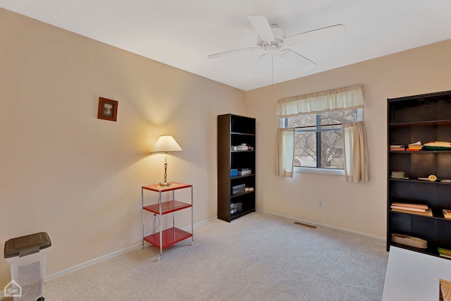 miscellaneous room featuring light carpet and ceiling fan