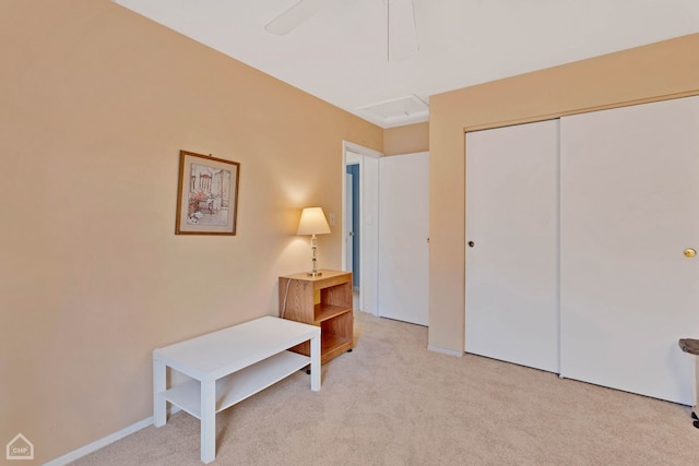 living area featuring light colored carpet