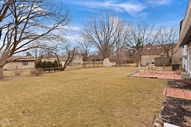 view of yard with a storage unit and a patio