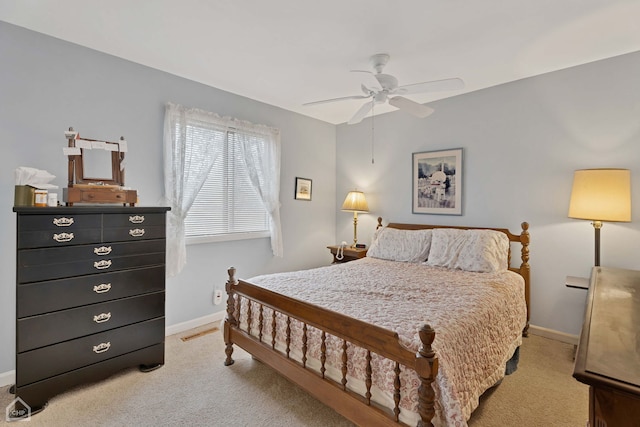 bedroom with ceiling fan and light colored carpet