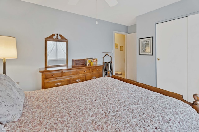 bedroom with ceiling fan and a closet