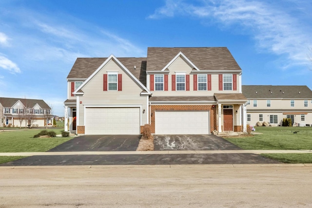 view of front of home featuring a garage and a front yard