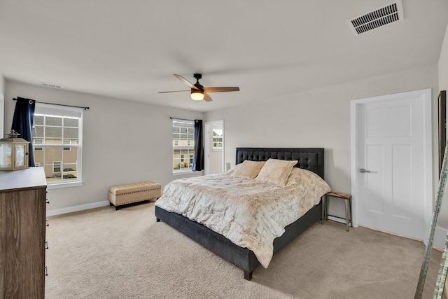 bedroom with light colored carpet and ceiling fan