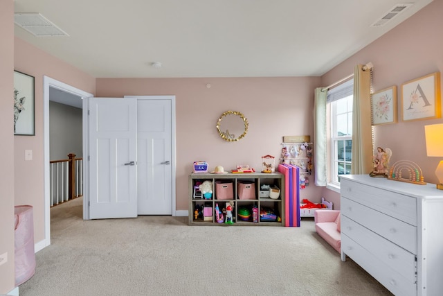 playroom featuring light colored carpet