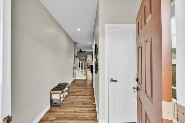 hallway with light hardwood / wood-style floors