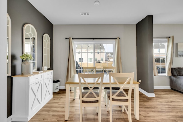 dining area with light wood-type flooring