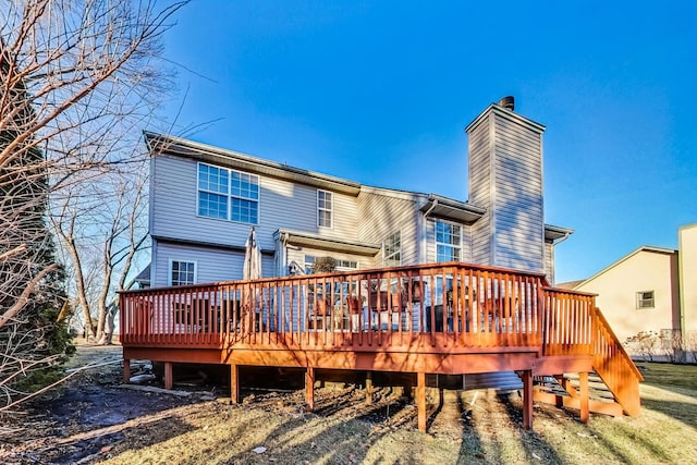 rear view of house with a wooden deck