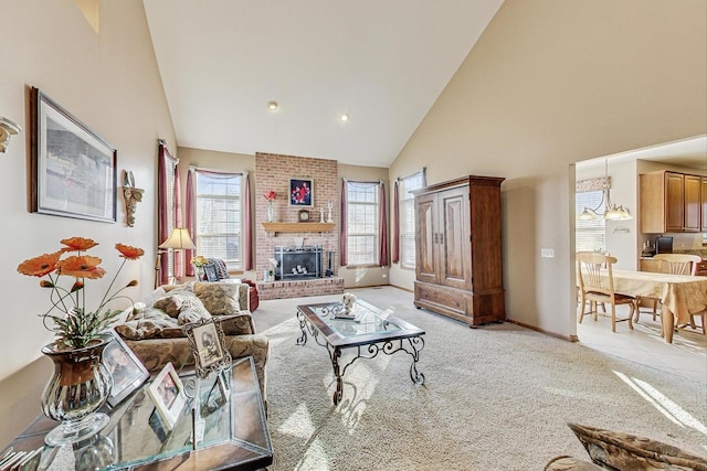 living room featuring light carpet, a fireplace, and high vaulted ceiling