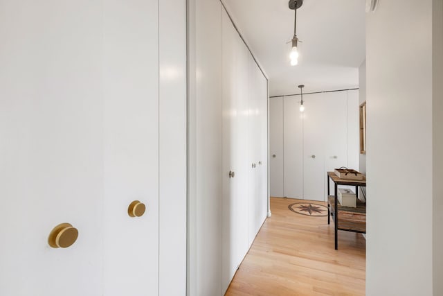 hallway with light wood-type flooring